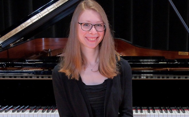 Cynthia Bryndis Schilling sitting at the piano.