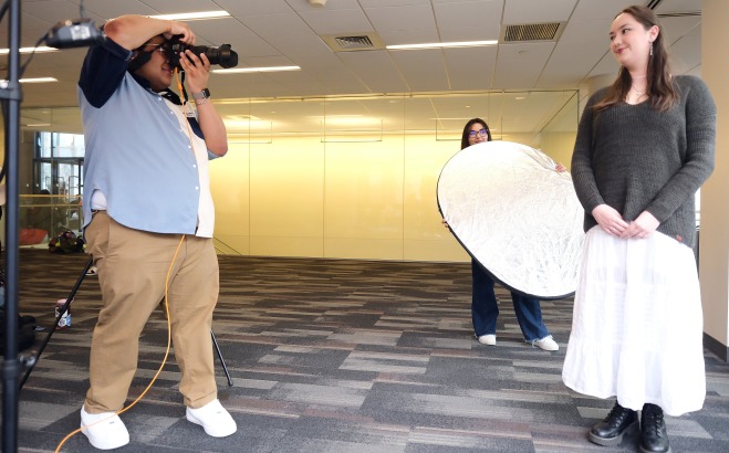 Comm Media photography students taking headshots