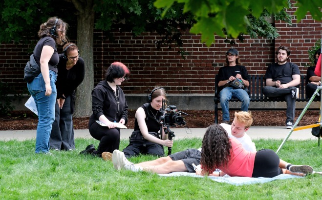 Toni Magras filming with students on the quad