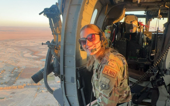 Image of Julia Gauvin in a helicopter