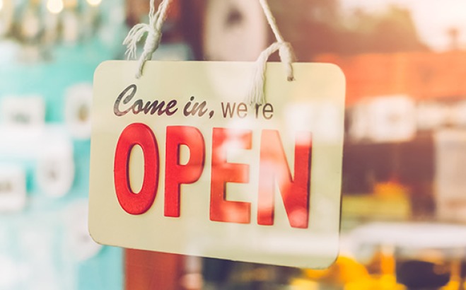 Open sign in a store window.