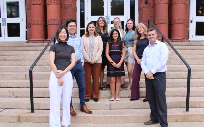 Group photo of the counseling services staff on steps of Thompson Hall