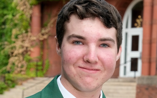 Aidan Thompson headshot outside in front of Thompson Hall. 