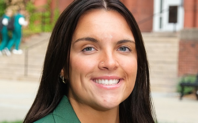 Alexis Desimone headshot outside in front of Thompson Hall. 