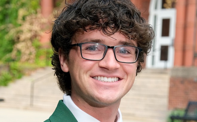Matthew Gill headshot outside in front of Thompson Hall. 