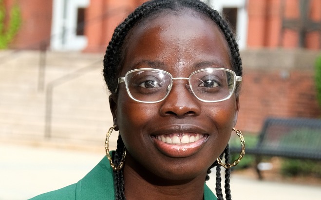 Priscilla Fordjour headshot outside in front of Thompson Hall. 