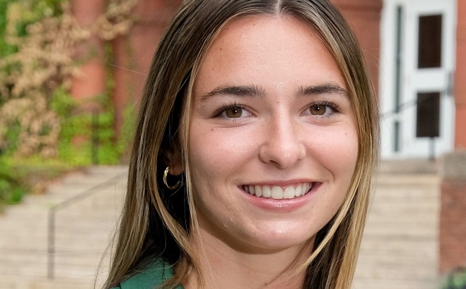 Sophia Moore headshot outside in front of Thompson Hall. 
