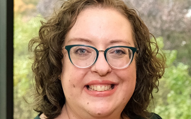 Susan Beddes CSA inside near a window