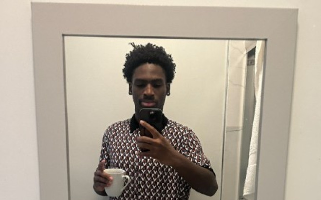 Edwin Armah selfie in a bathroom mirror.