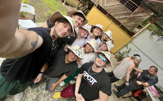 Selfie of students in Costa Rica with hats on.
