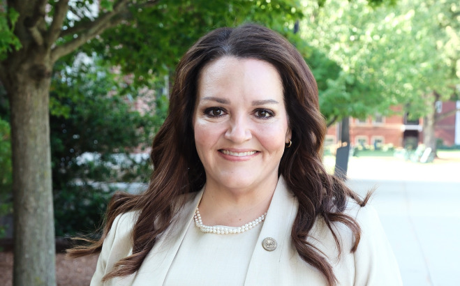 President Donna Hodge headshot outside.