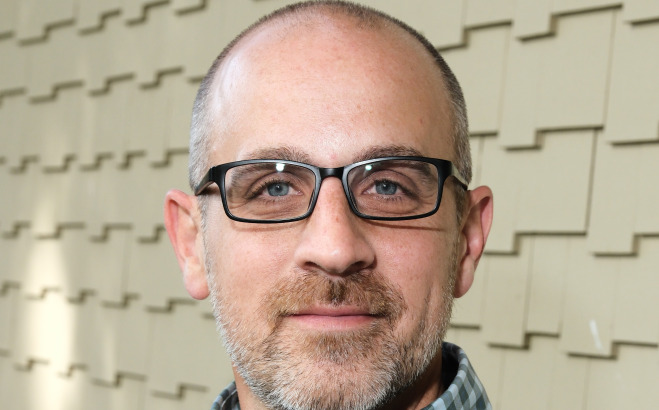Chris Adams headshot Presidential Fellow.