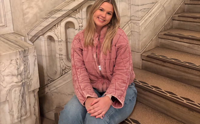 Madison Luce ACT in a stairwell.