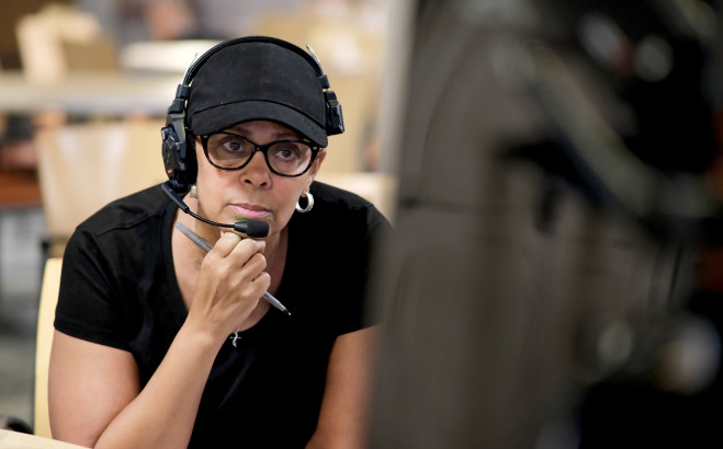 Close up of Toni Magras with headset on.