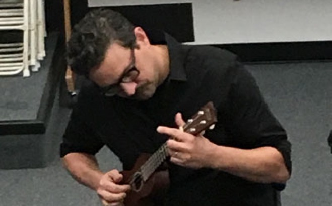 Student playing the ukulele