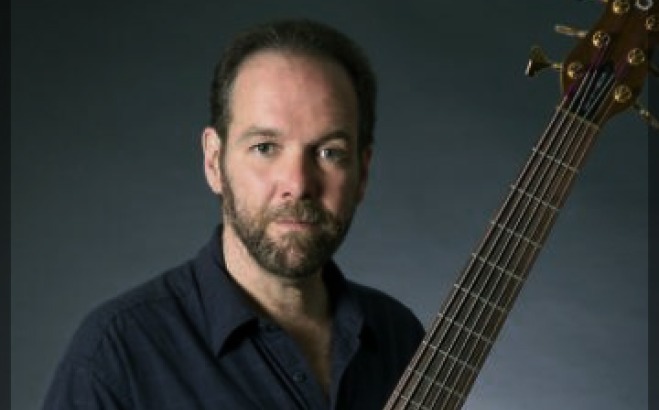 David Hines holding guitar.