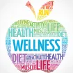 A colorful apple shape made of words related to health and wellness, including "WELLNESS," "HEALTH," and "DIET," in various fonts and colors.