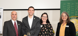 Photo of Michael Kushmerek with President Lapidus, Carissa Kushmerek, and Dawn Morton