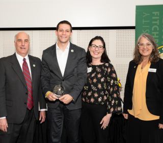 Photo of Michael Kushmerek with President Lapidus, Carissa Kushmerek, and Dawn Morton