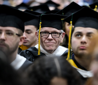 Stephen Wells smiles at winter commencement 2023