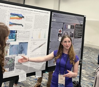 Student Madison Ambrogi '26 and alum Kate Messer 24 presenting research in Texas