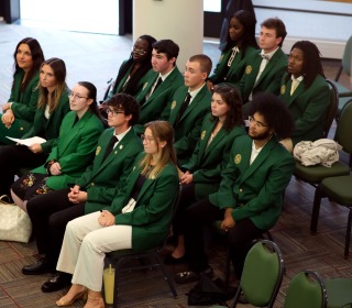 Presidential Ambassadors sitting at the showcase in Hammond