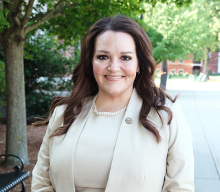 President Donna Hodge headshot outside.
