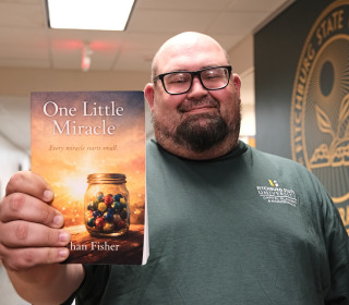 Nathan Fisher, a maintainer employee, writes book