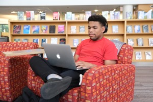 Student on computer in campus library