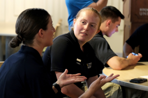Two female police students talking