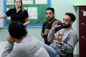 Eliezer Rivera and Fernando GR talking to students at Fitchburg High School.