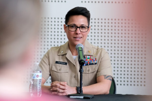 Military Friendly School designation former student in Marines seated