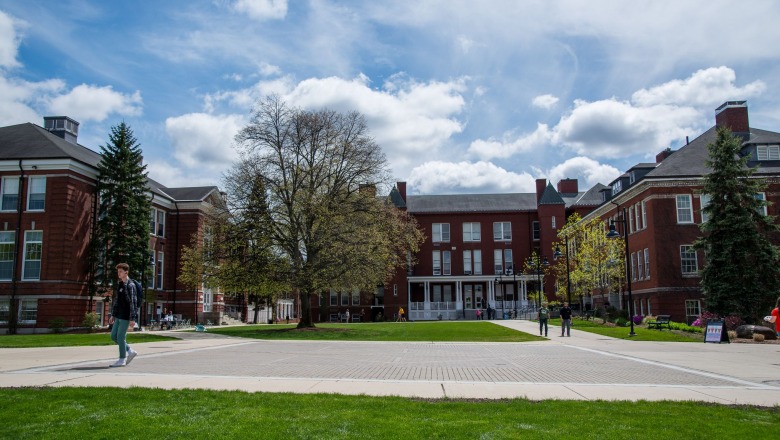 Students walking across quad on a sunny afternoon