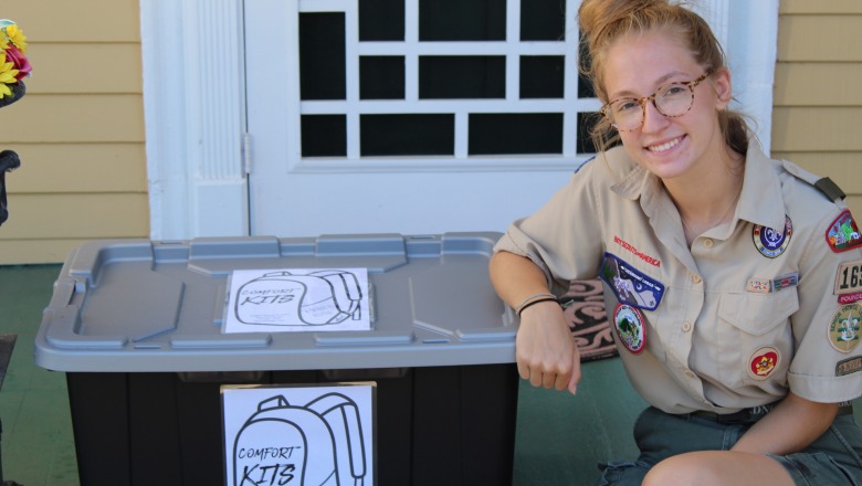 Erin Donelan poses with one of the comfort kits she created for her Eagle Scout project