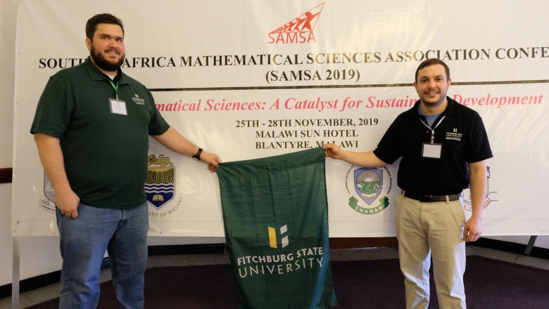 Student Matthew Foster and Professor Ben Levy presenting in Africa