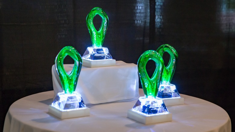 Faculty award trophies on a table