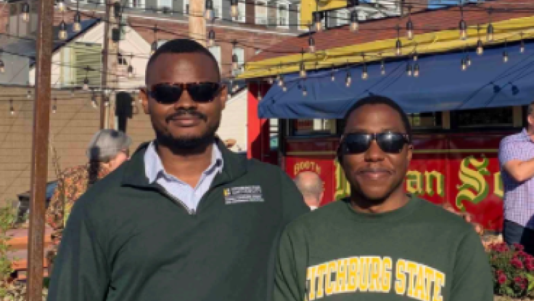 International students Dotun Opasina and Muchafara Punungwe at downtown Fitchburg event