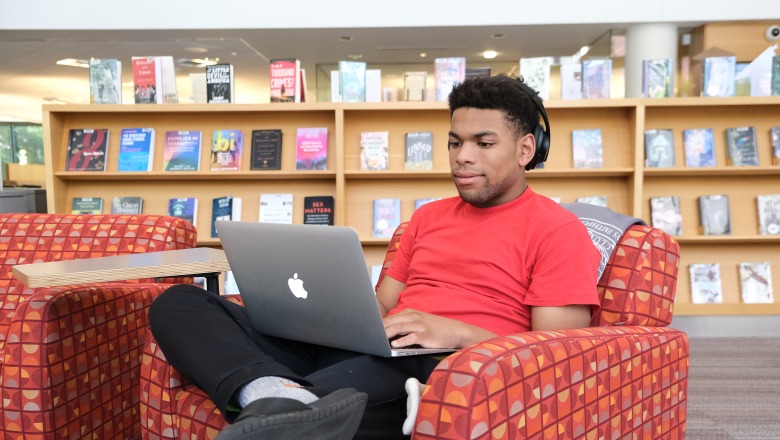 Student on computer in campus library