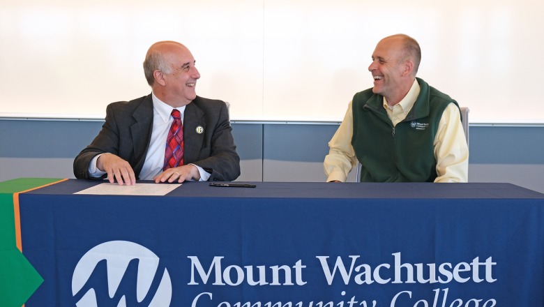 President Lapidus and MWCC President James Vander Hooven sign an articulation agreement on July 12 2022