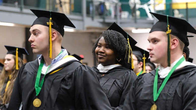 Students at end of winter commencement two male and two females