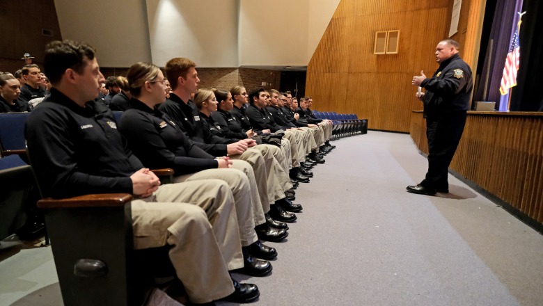 Police Chief Martineau with police students in Weston Auditorium