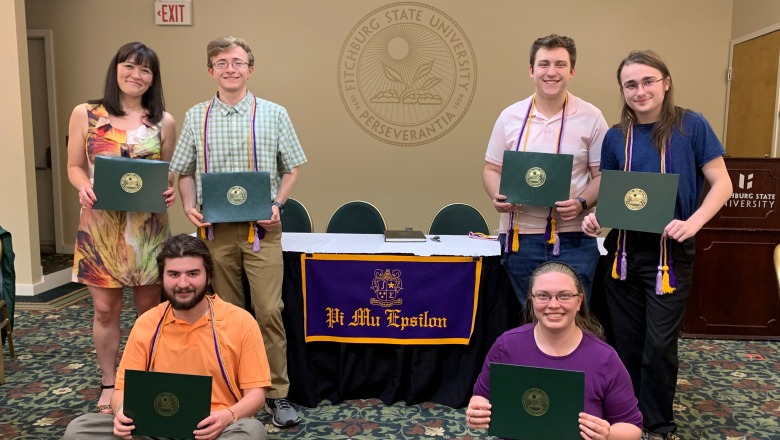 Math Honor Society (PME) Inductees 2023 posing with their awards in President's Hall
