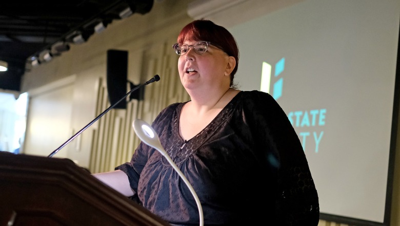 Professor Kisha Tracy at podium