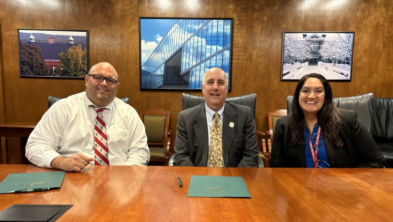 FPS Superintendent Jon Thompson, President Lapidus and FPS Assistant Superintendent Colon smile at Honors Compact signing