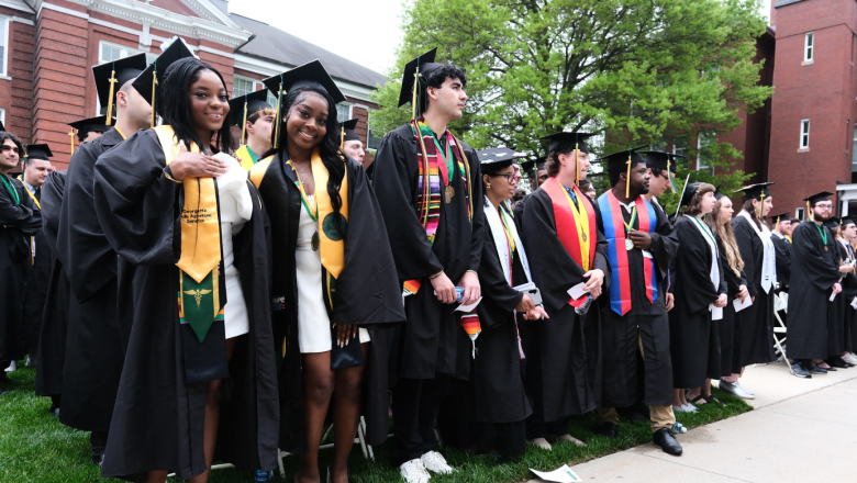 Students pose in regalia at Spring 2025 undergraduate commencement