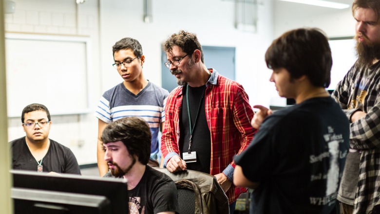 Professor Jeff Warmouth with Game Design students