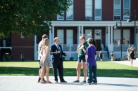 President Lapidus speaks with students on the quad 