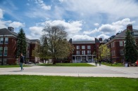 Students walking across quad on a sunny afternoon