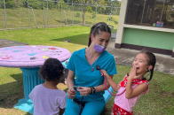 Nursing student Genevieve Casucci with children on a trip to Costa Rica