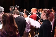 Choir members rehearsing